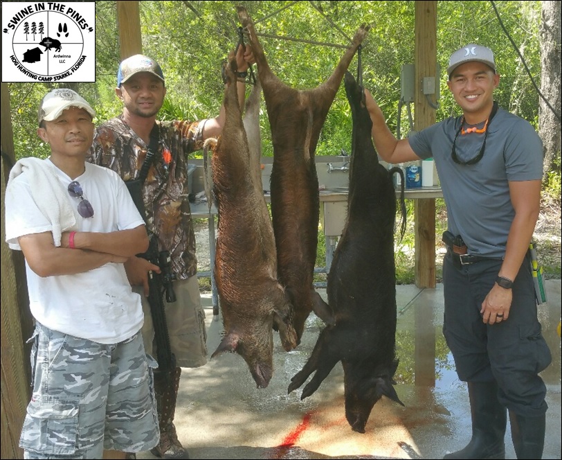 Ron, Jazon, and John with all three of their Piney Woods Roters at Swine In The Pines